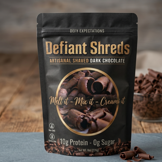 Defiant Shreds artisanal shaved dark chocolate packaging on a wooden surface